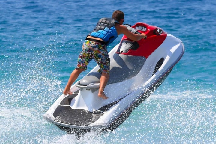 a person riding a surf board on a body of water